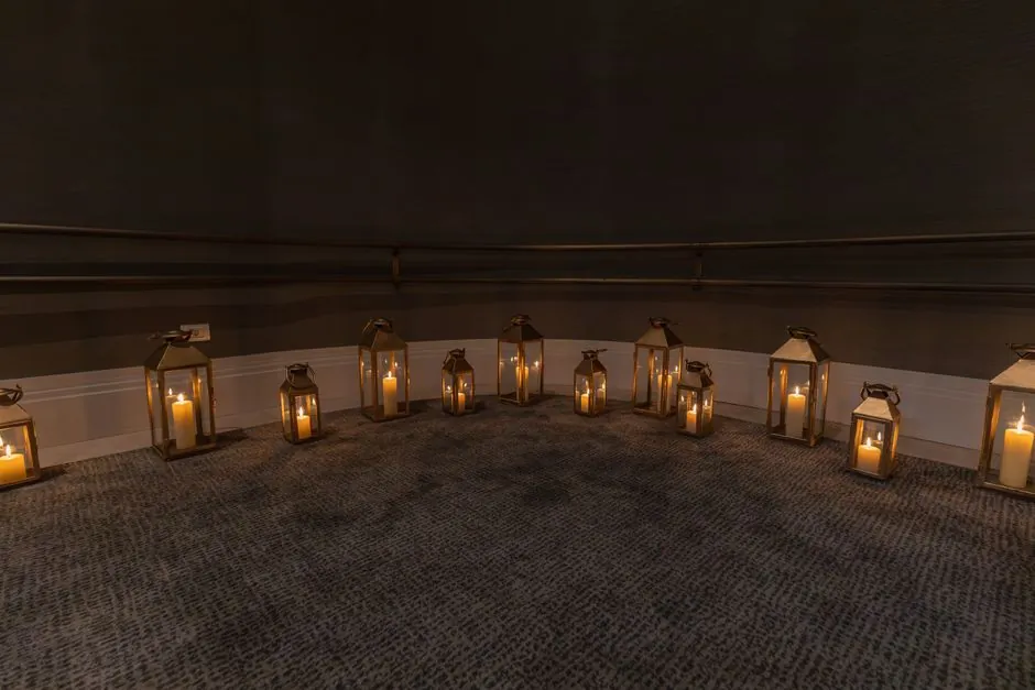 Candlelit lodge chamber welcoming new Entered Apprentice candidates to initiation