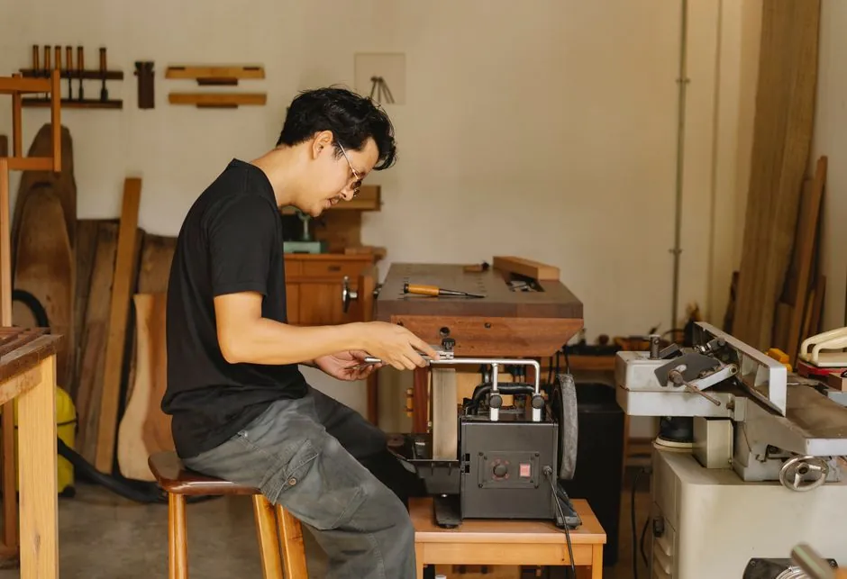 Master craftsman sharpening tools embodies Freemasonry's dedication to skilled workmanship