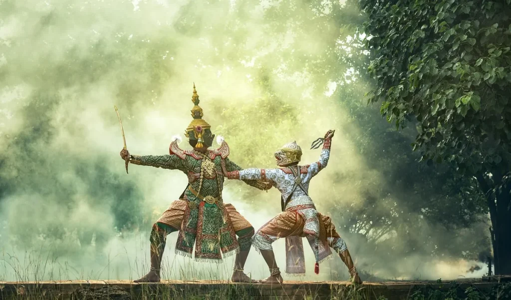 Traditional masked dancer in green costume representing hierarchical theatrical progression